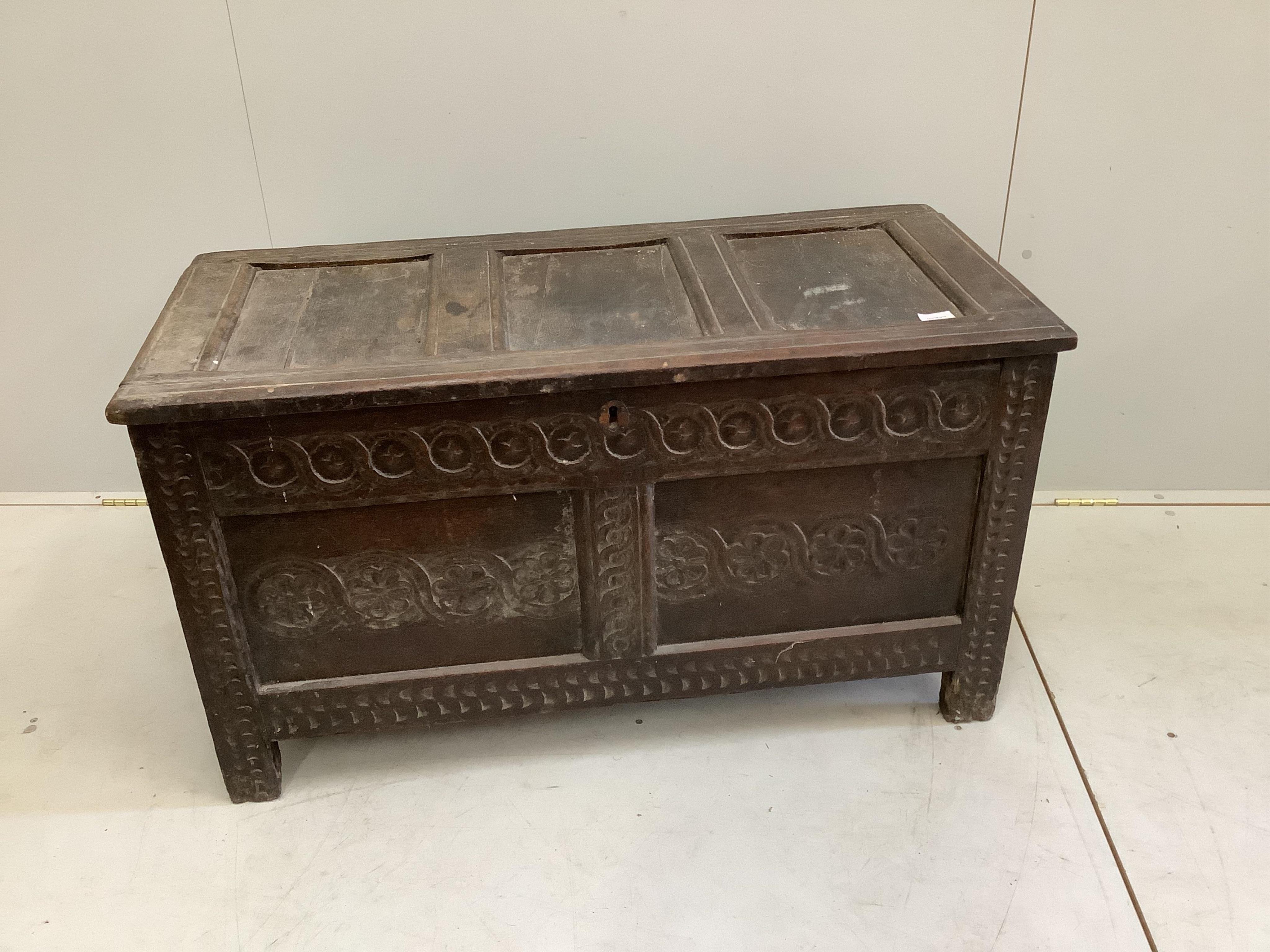 A 17th century oak coffer, width 106cm, depth 48cm, height 59cm. Condition - fair